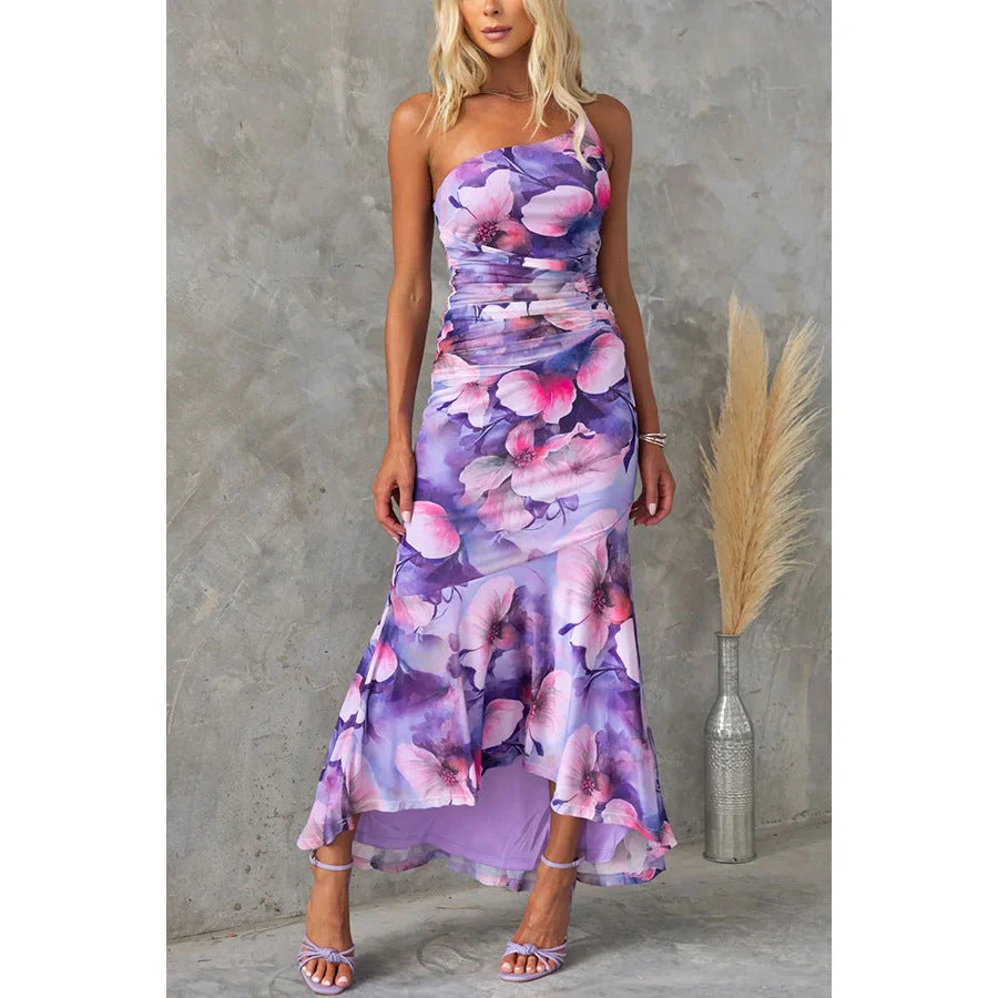 Elegant floral one-shoulder summer dress with suspender detail in vibrant colours