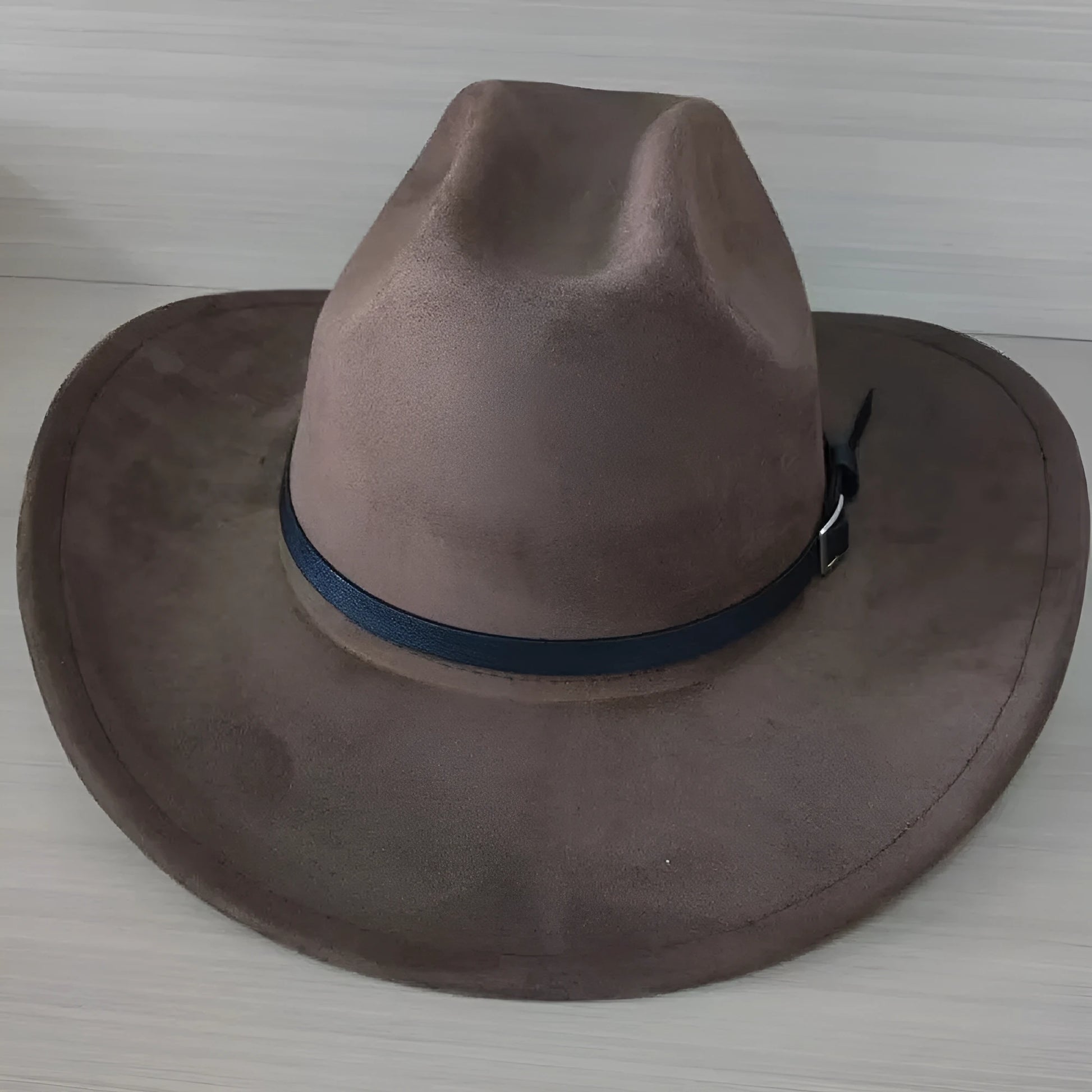 Brown leather velvet Western cowboy hat with curved brim and conical crown