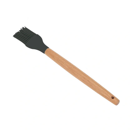 Dark grey silicone cooking utensils with wooden handles including spatula, spoon, whisk, and tongs