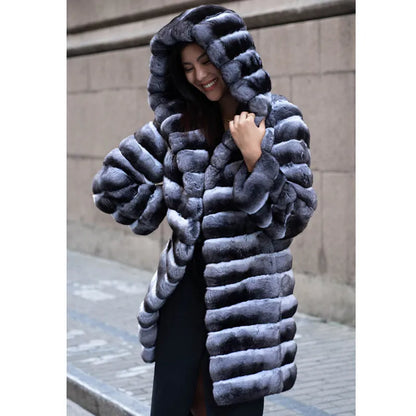 Women's zebra stripe pattern faux fur overcoat with regular sleeves, shown in a medium length.