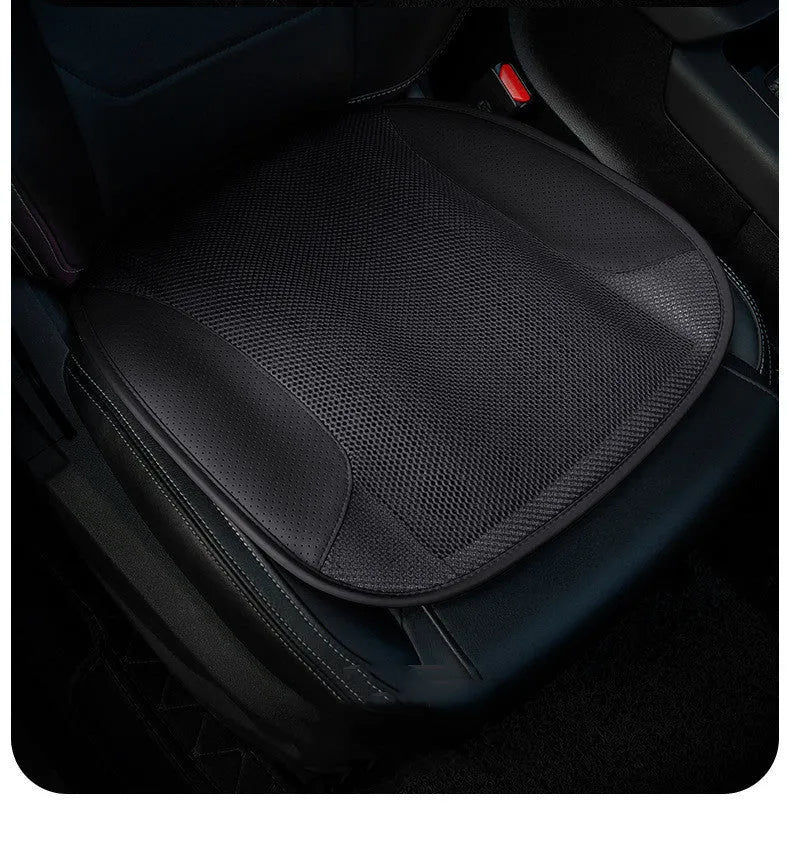 USB ventilated car seat cushion in black suede with visible fan vents, placed on a car seat.
