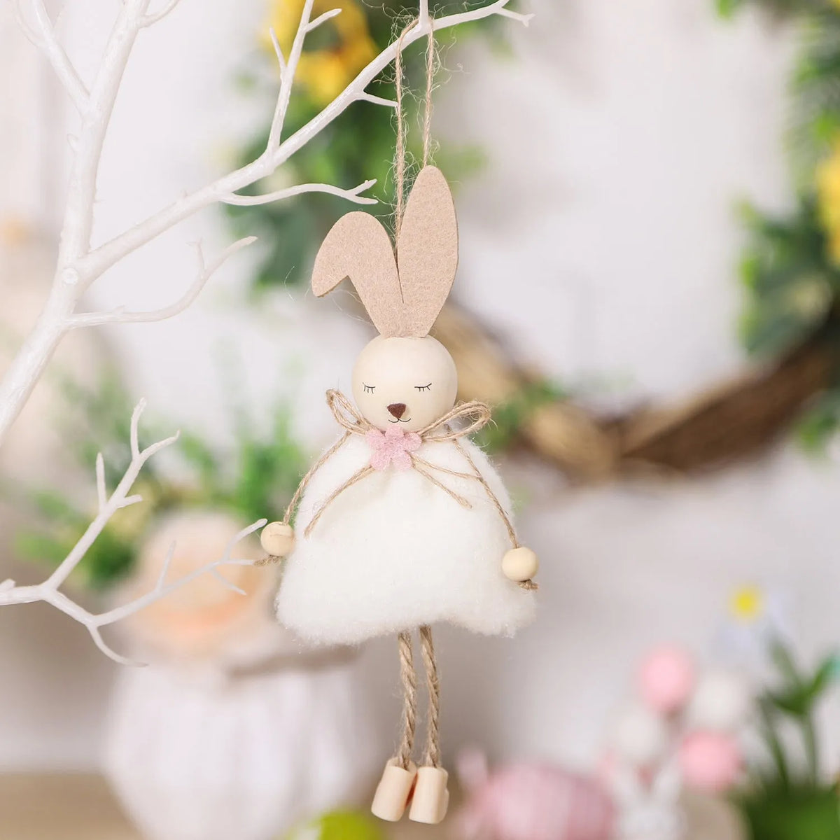 Cartoon rabbit cloth pendant Easter decoration hanging from a ribbon.