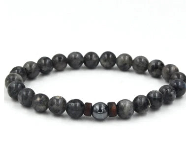A stylish and durable men's bracelet made with volcanic stone, flash stone, and wood chips