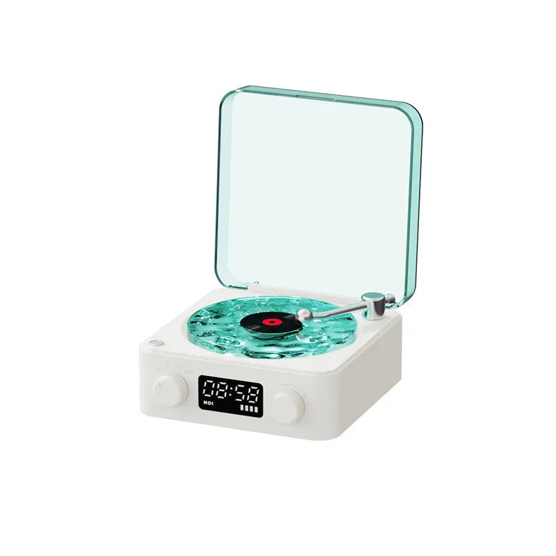Retro-style turntable Bluetooth speaker with glowing RGB light projection on a wooden surface.