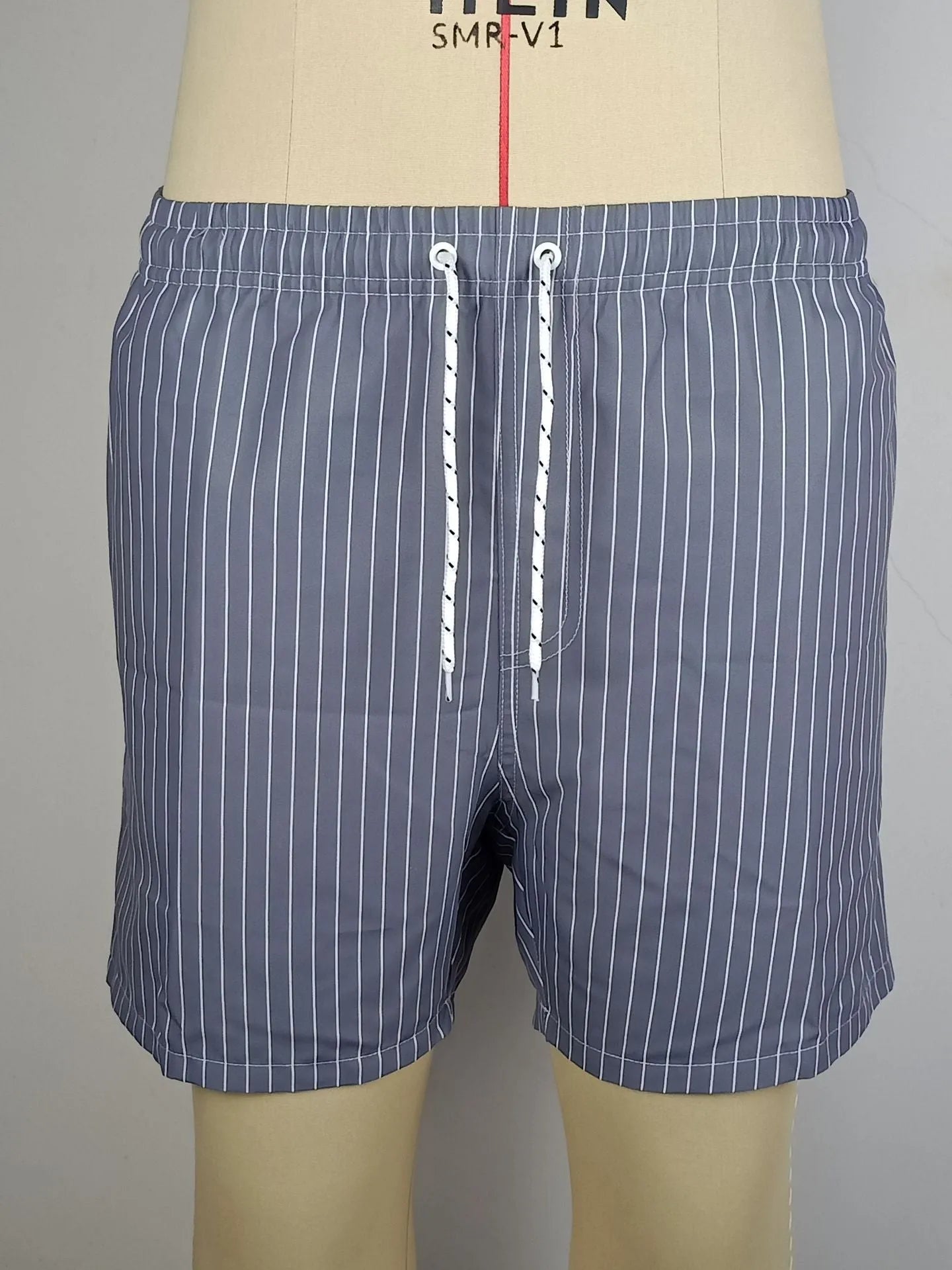 Men's navy blue striped casual shorts with a straight leg opening and triangle lining laid flat.