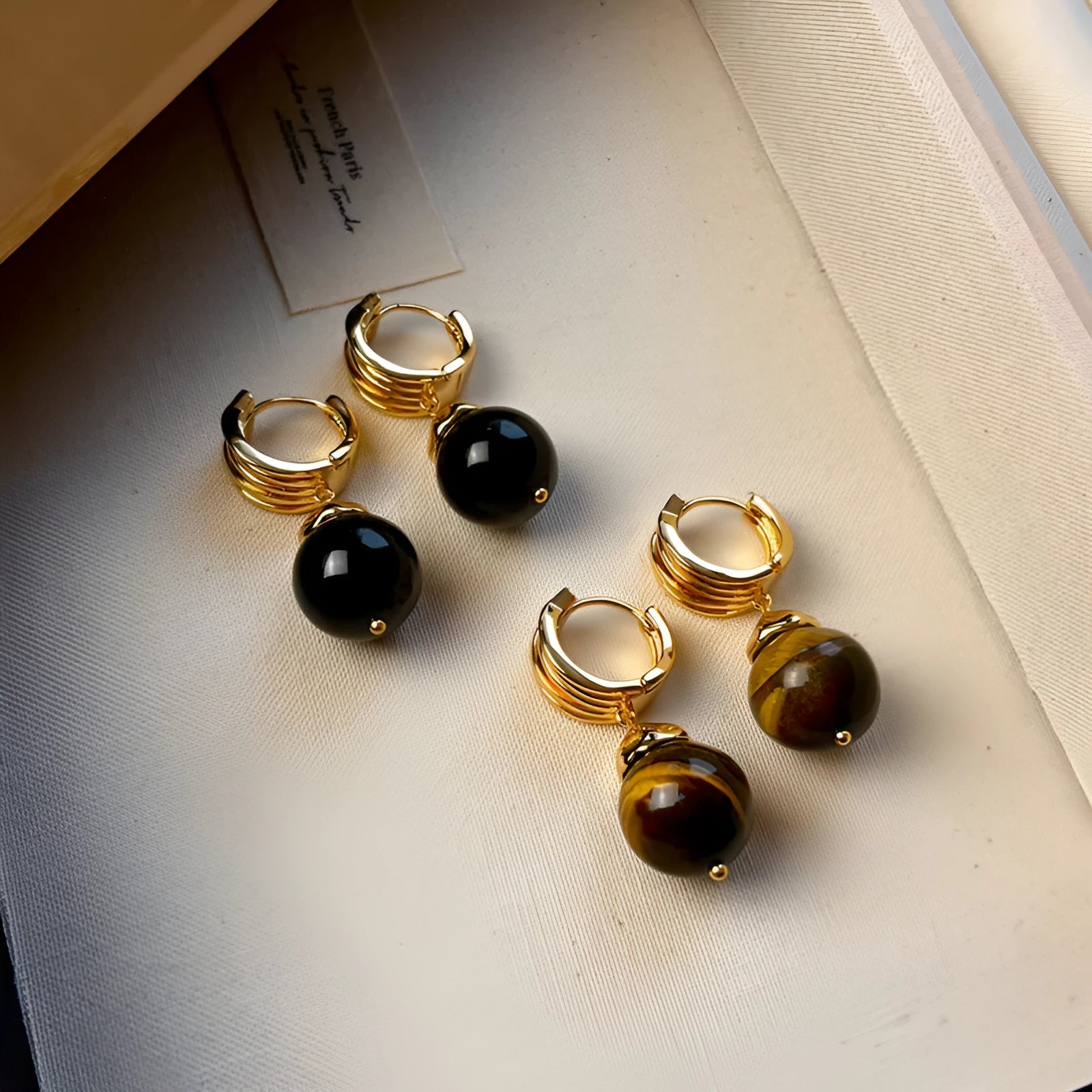 Geometric tigereye earrings with gold plating in black and brown colour options