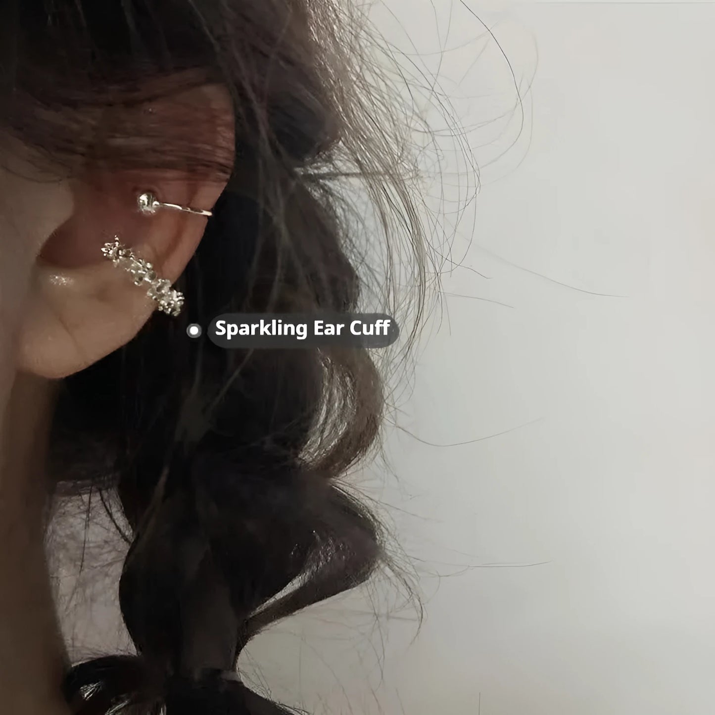 A pair of frosty-finish geometric clip-on earrings with an irregular abstract shape.
