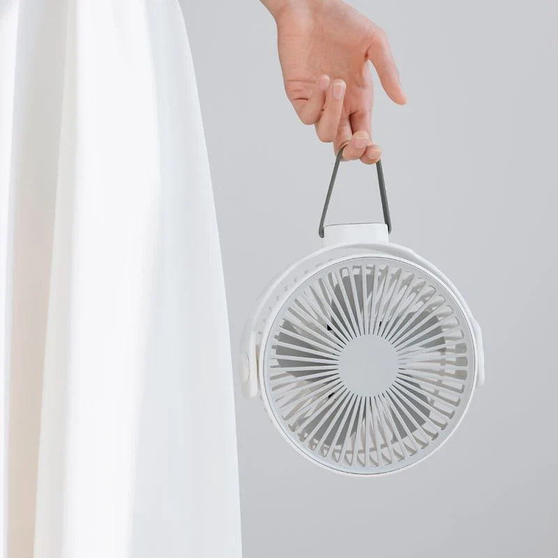 Portable USB desk fan with 360-degree rotation, multiple wind speeds, and long-lasting battery life