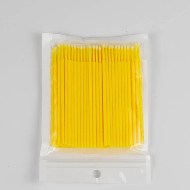 Disposable micro applicator brushes with coloured plastic handles and bendable cotton swab tips