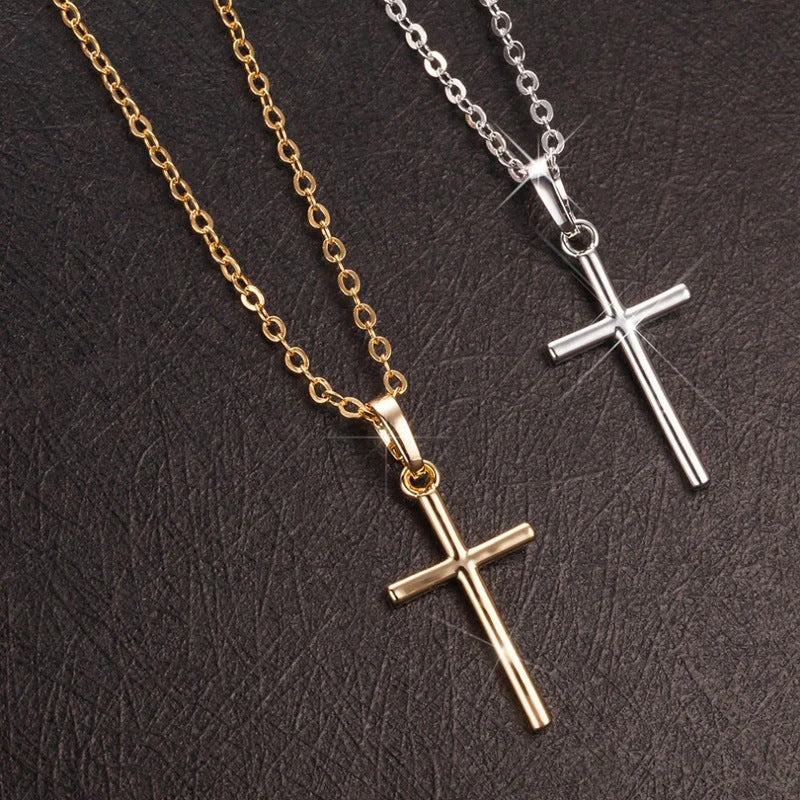 Elegant cross pendant necklace in gold and silver tones, a timeless British accessory