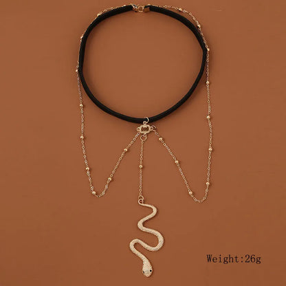 Gold colour alloy thigh chain with big snake pendant and beaded geometric leg chain design