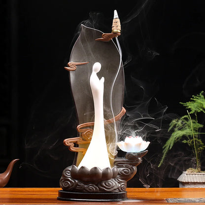 Purple clay tea pet ornament with downward flowing incense smoke and warm LED illumination