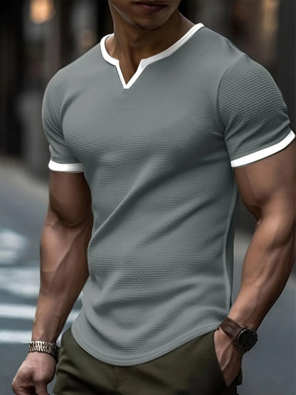 V-neck colour-block waffle texture outdoor sports T-shirt in polyester fabric on a neutral background.