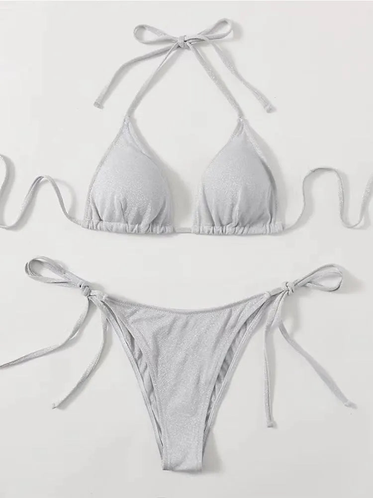 Women's khaki gold bandage bikini with adjustable straps on a beach background