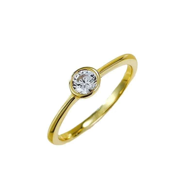 Minimalist crown-shaped silver ring in Korean style with linear design, shown in gold or platinum finish.