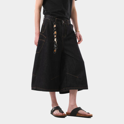 Black retro washed cropped denim trousers for men on a hanger