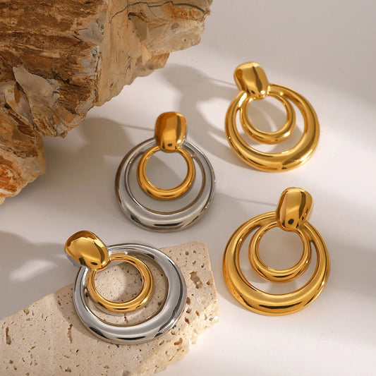 Round double layer hollow stud earrings with 18K gold electroplating on titanium steel, 12mm diameter