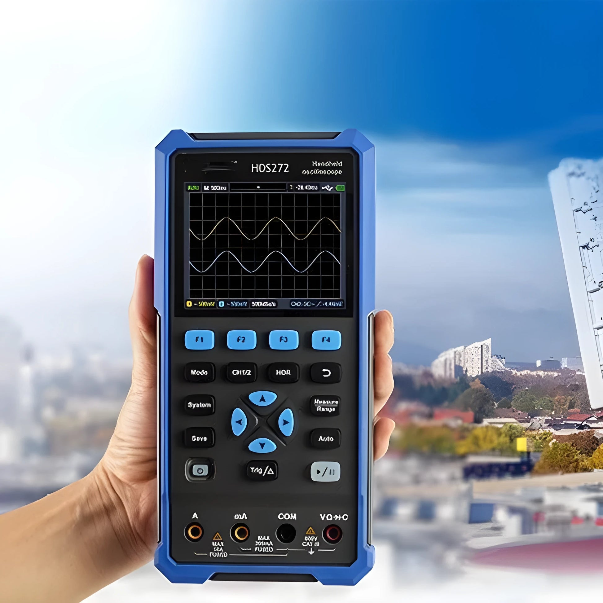 Owon HDS272 handheld digital oscilloscope with probe and accessories on workbench