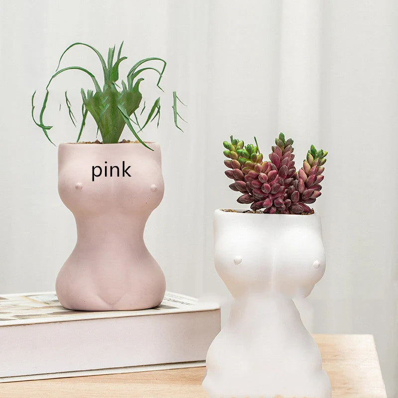 Elegant ceramic flower pots in various colours, featuring intricate designs inspired by classic European styles