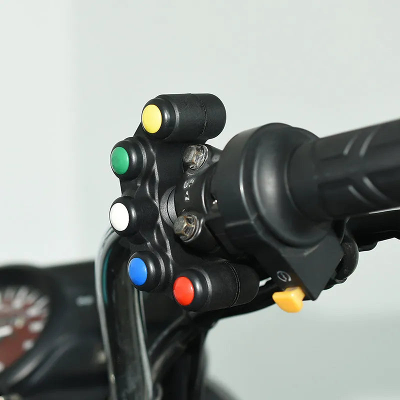 Plastic five-colour five-position vehicle function switch with red, yellow, blue, green, and white buttons and a black cable.