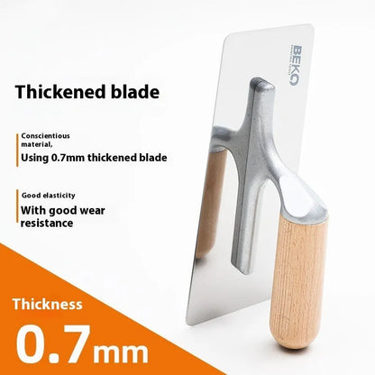 Stainless steel putty scraper with wooden handle shown in three different blade sizes on a workbench.