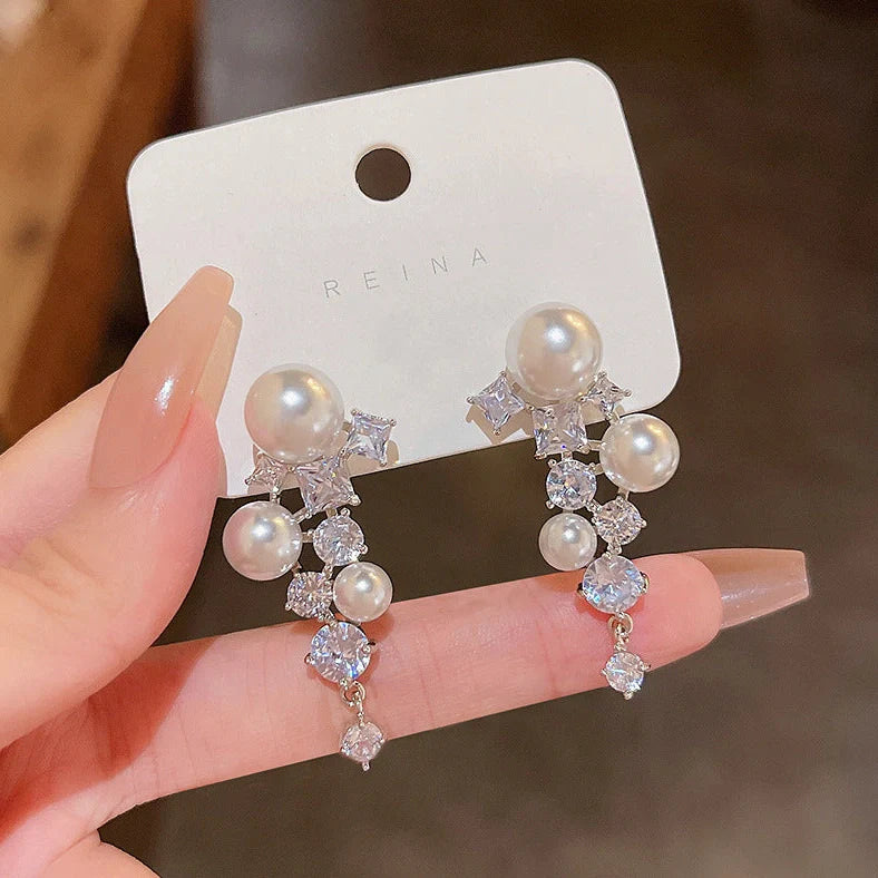 Gold electroplated floral earrings with pearl accents on S925 silver posts