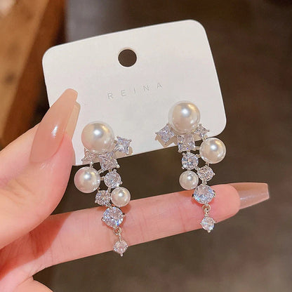 Gold electroplated floral earrings with pearl accents on S925 silver posts