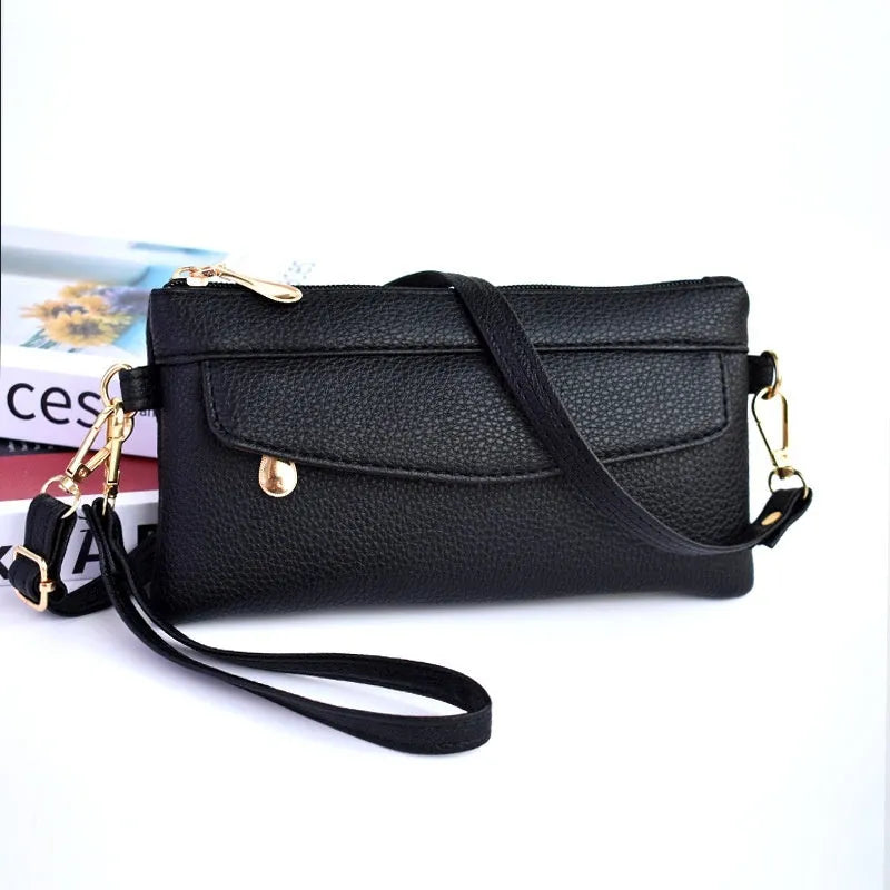 Soft surface square PU crossbody bag and clutch with internal zipper pocket in various colours.