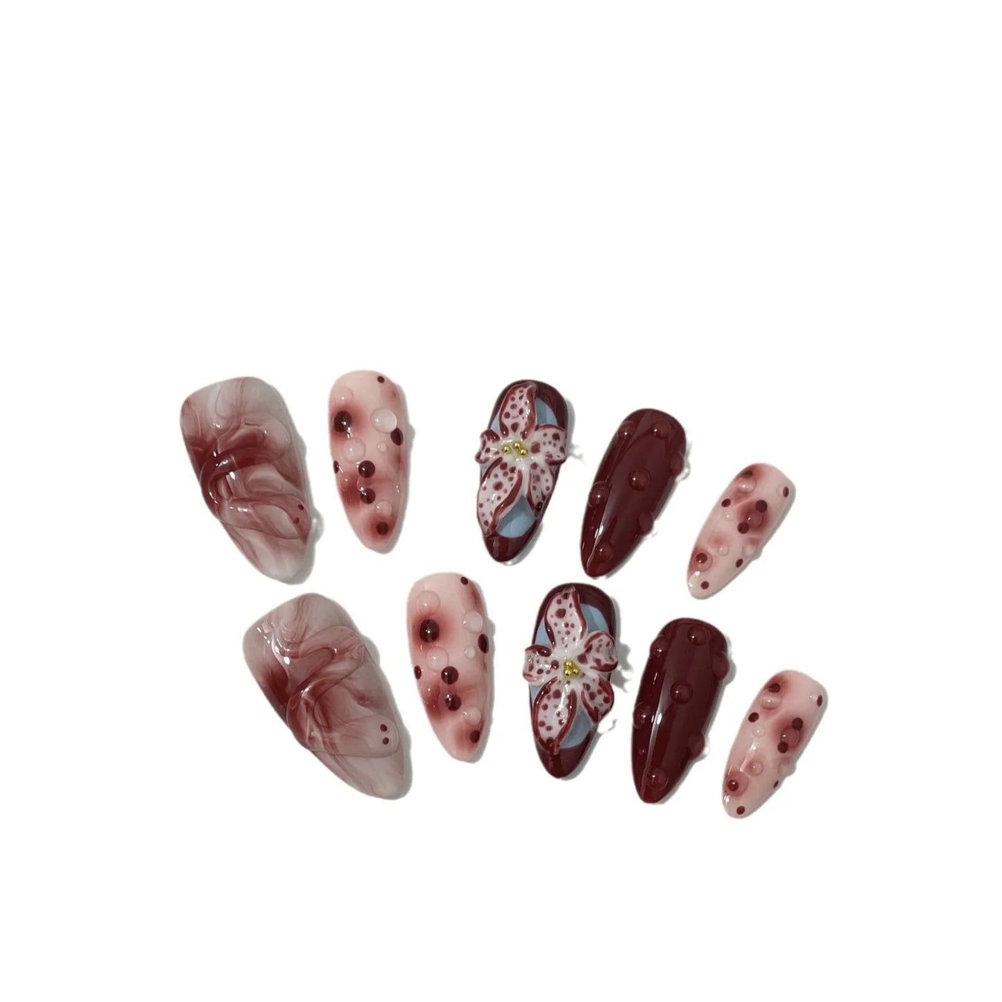 Hand-painted 3D carved nail wraps in Almond colour showing floral and geometric designs for mid-length manicures.