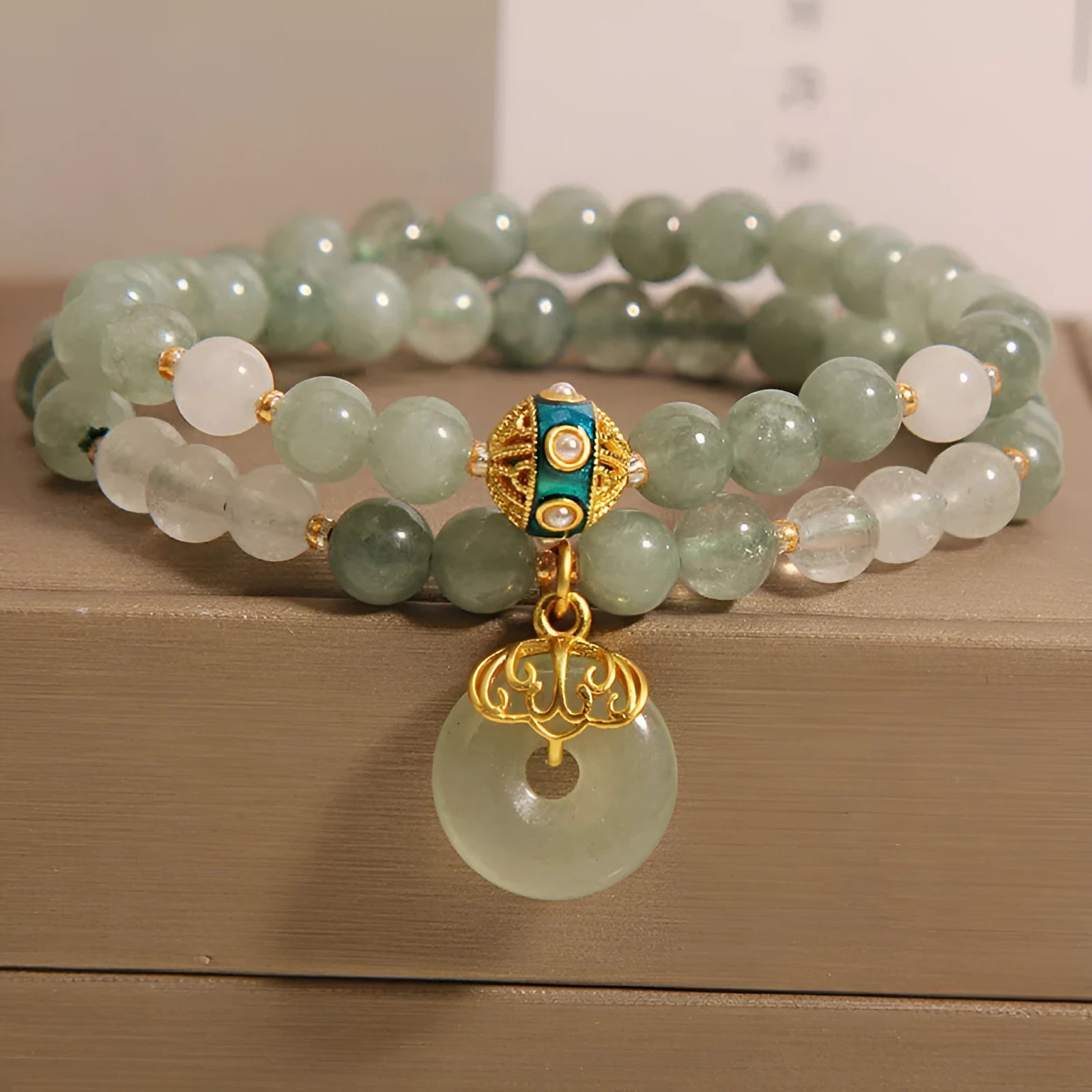 Women's aventurine double-layer jade bracelet with peace buckle closure and rhinestone details