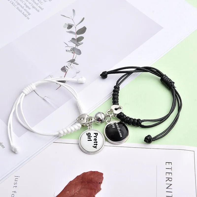A pair of magnet couple bracelets with a suction clasp, showing various design options like clovers, crowns, and hearts.