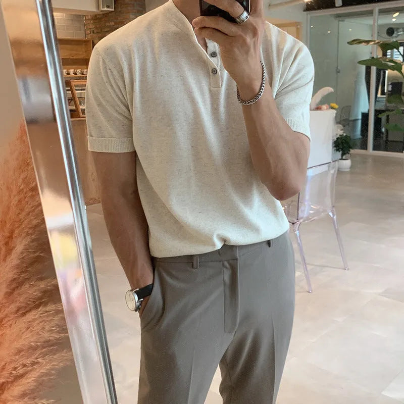 Man wearing a black slim-fit short-sleeved ice silk knit pullover shirt.