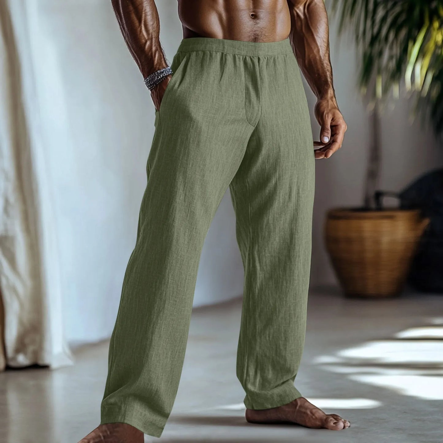 Straight leg cotton linen trousers in light green, shown with side pockets and a casual fit.