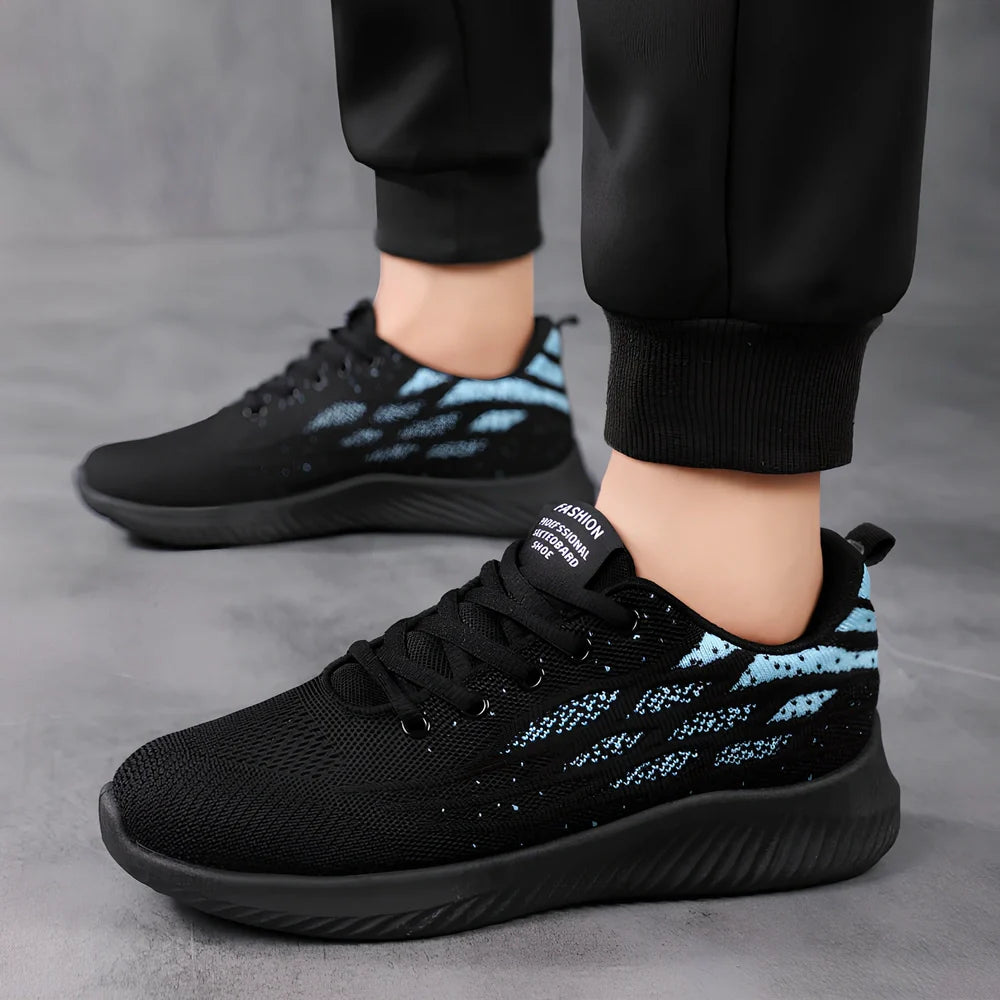 Men's black mesh sports shoes with red accent details and flexible PVC sole construction