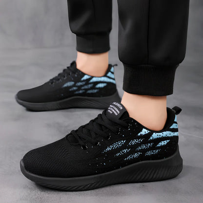 Men's black mesh sports shoes with red accent details and flexible PVC sole construction