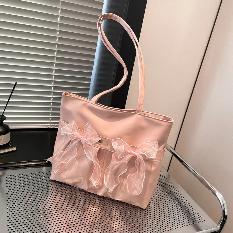 College style bow tote bag in black PU leather with double shoulder straps and bow detailing
