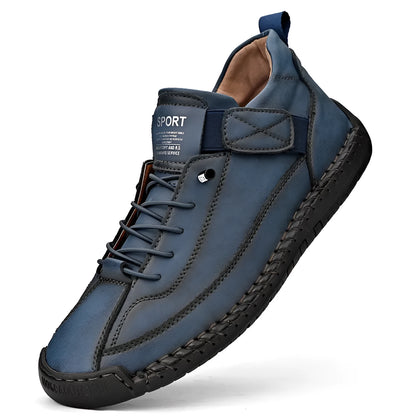 Men's black mid-top Martin boots with elastic band and sewn sole on a plain background.