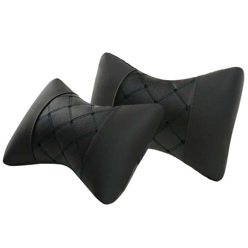 Black leather quilted car headrest with diamond pattern and red stitching lines on cervical support pillow