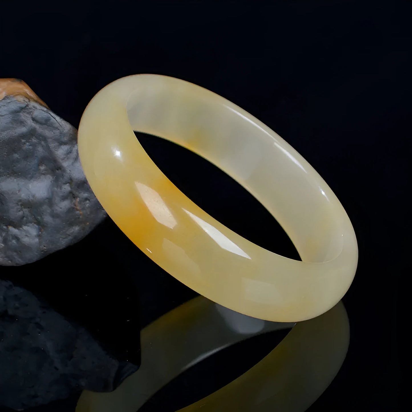 A polished natural jade bracelet in a traditional Chinese style, shown with a size guide for 54mm to 62mm.