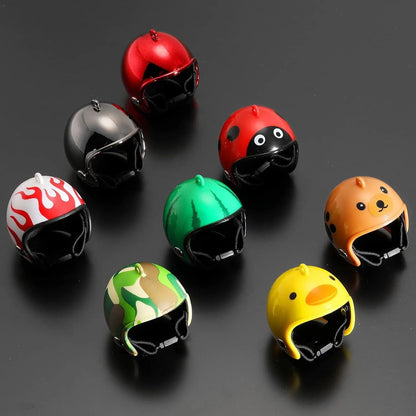 Small hard plastic helmet with elastic straps and sponge lining, designed for a chicken or bird to wear.