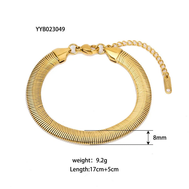 Elegant stainless steel bracelet with a sleek geometric design, gold-plated finish, and unisex style suitable for any occasion.