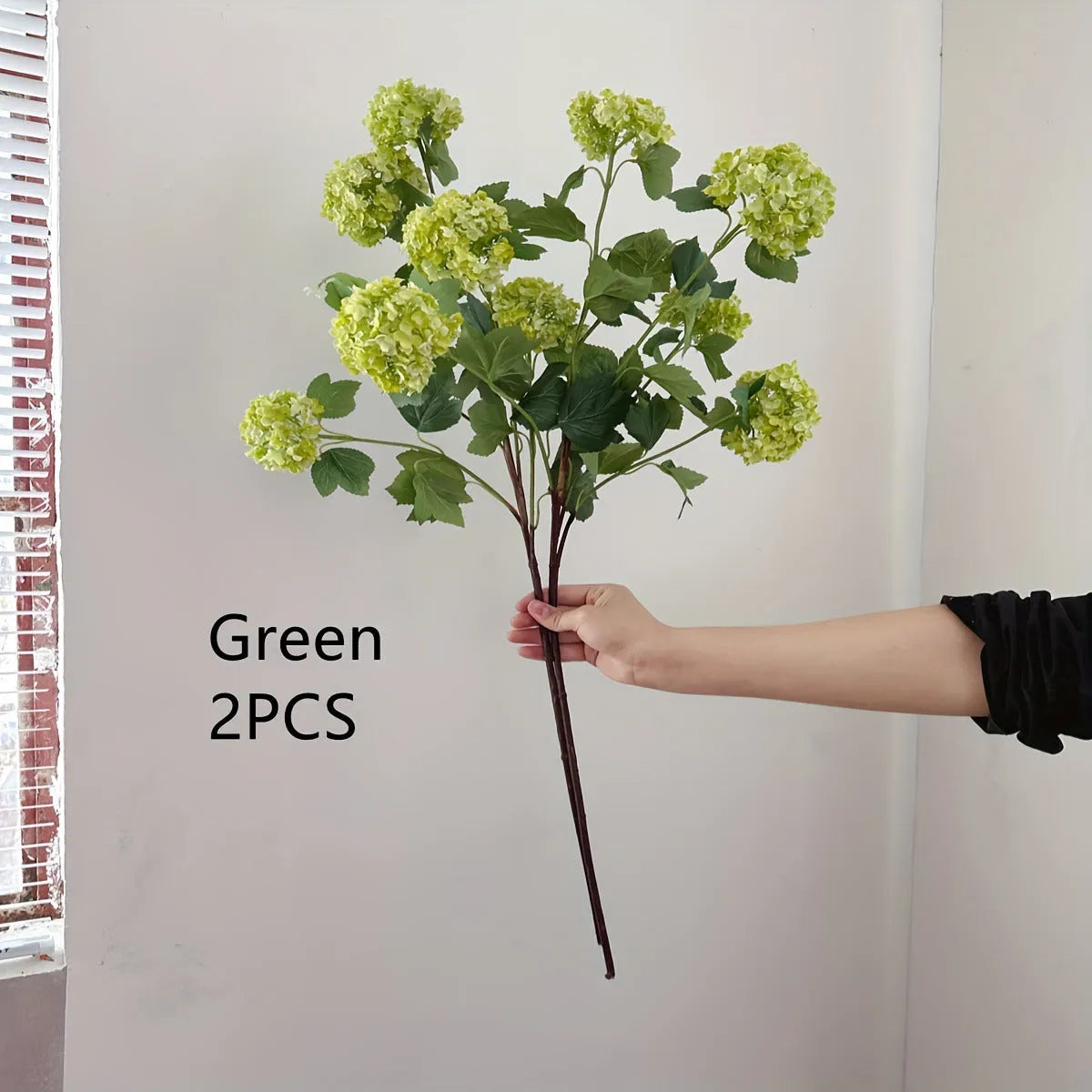Artificial silk hydrangea flower on long stem branch in white or green colour
