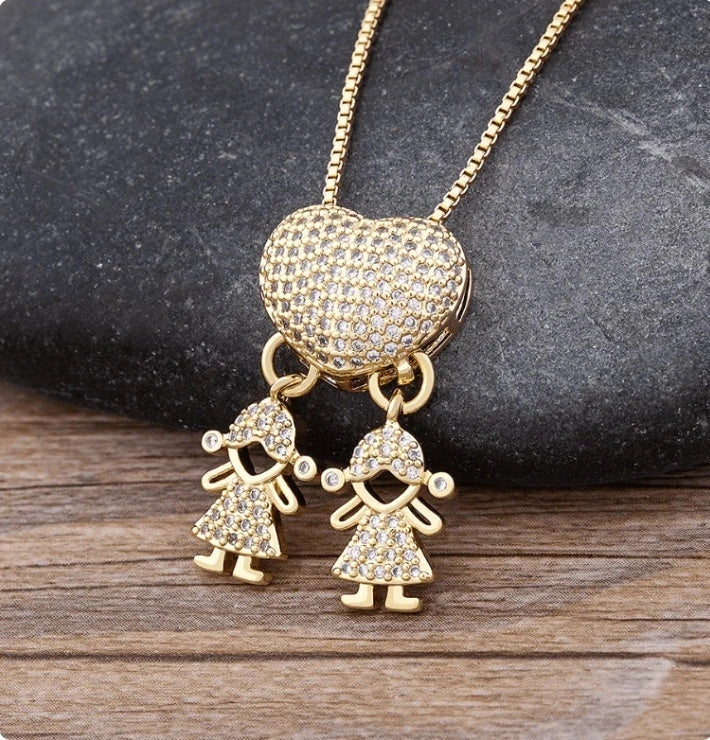 Gold cubic zirconia heart pendant necklace for mothers, symbolising family love.