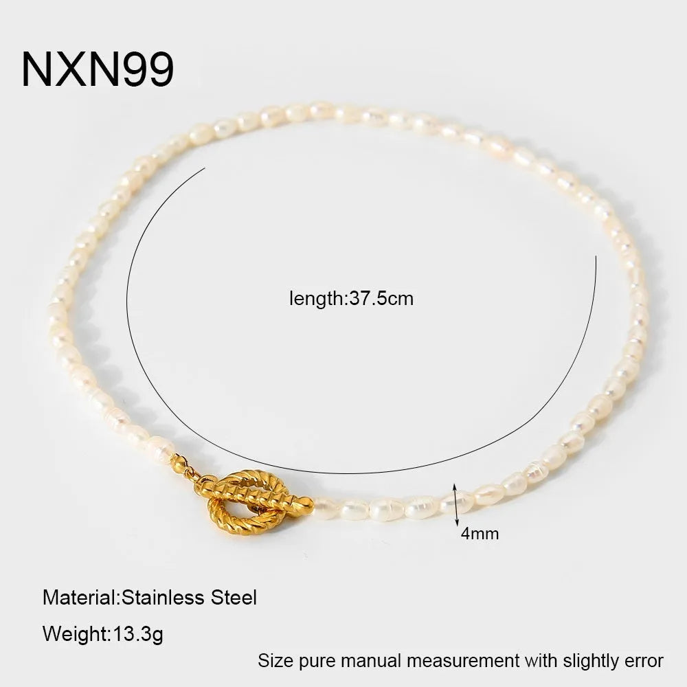 Freshwater pearl and stainless steel geometric pendant necklace with matching bracelet set.