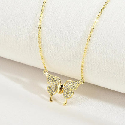 Close-up of a gold titanium steel twisted chain necklace with a magnetic butterfly clasp.