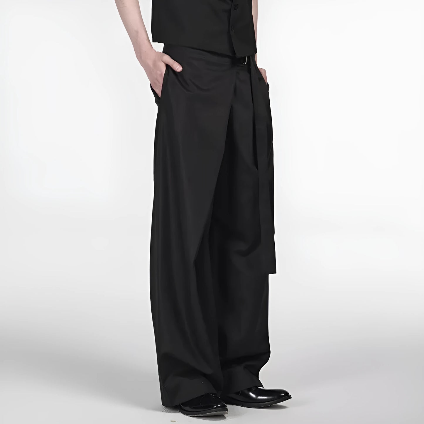 Black straight-leg trousers with single front pleat and adjustable waistband on a hanger