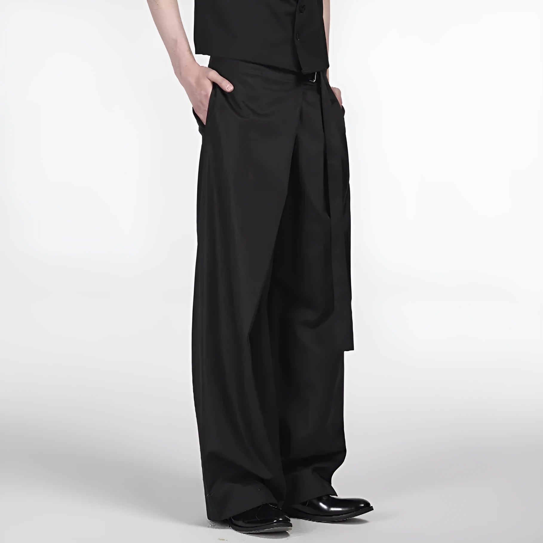 Black straight-leg trousers with single front pleat and adjustable waistband on a hanger