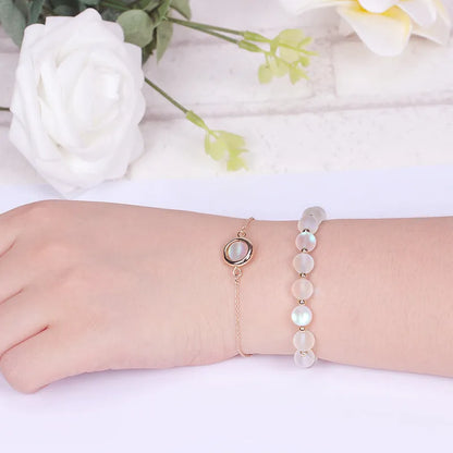 Double-layer women's bracelet with lucky beads and colourful crystals in gold-toned setting