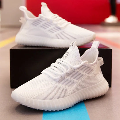 Men's white low-top sports shoes with breathable mesh lining and platform heel on a plain background.