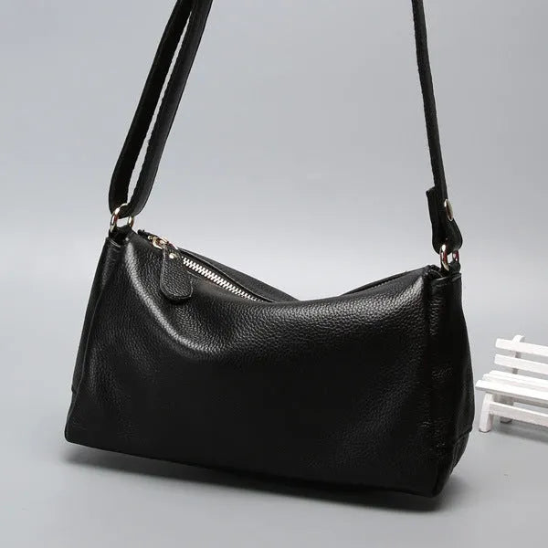 Soft genuine cowhide leather women's crossbody bag in horizontal square shape on a single strap.